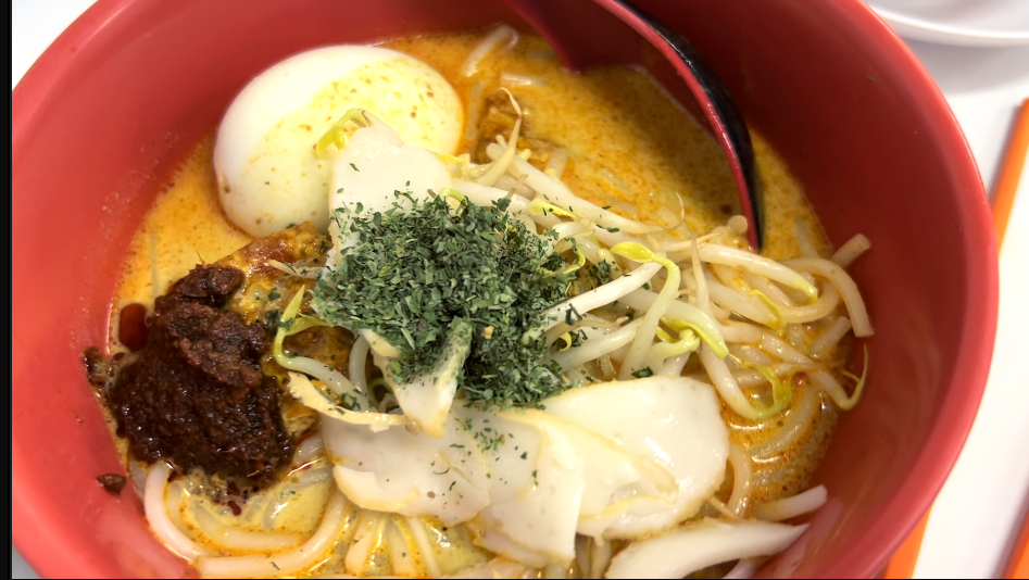 Vicky Ng eating Laksa at Killiney Kopitaim in Singapore trying out the the top sanwiches of the world